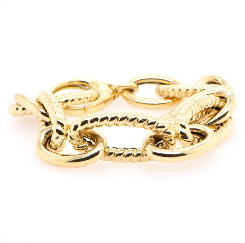 Ladies twisted bangles-14K Yellow Gold Fancy Oval Link Bracelet