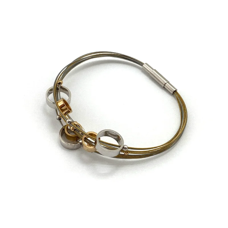 Ladies diamond tennis bracelets-Circular Gold and Silver Steel Cable Bracelet