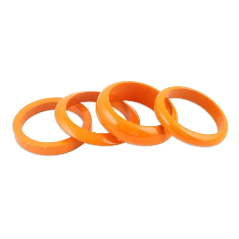 Ladies boho bracelets-Novica Handmade Orange Fusion Mango Wood Bangle Bracelets (Set Of 4)