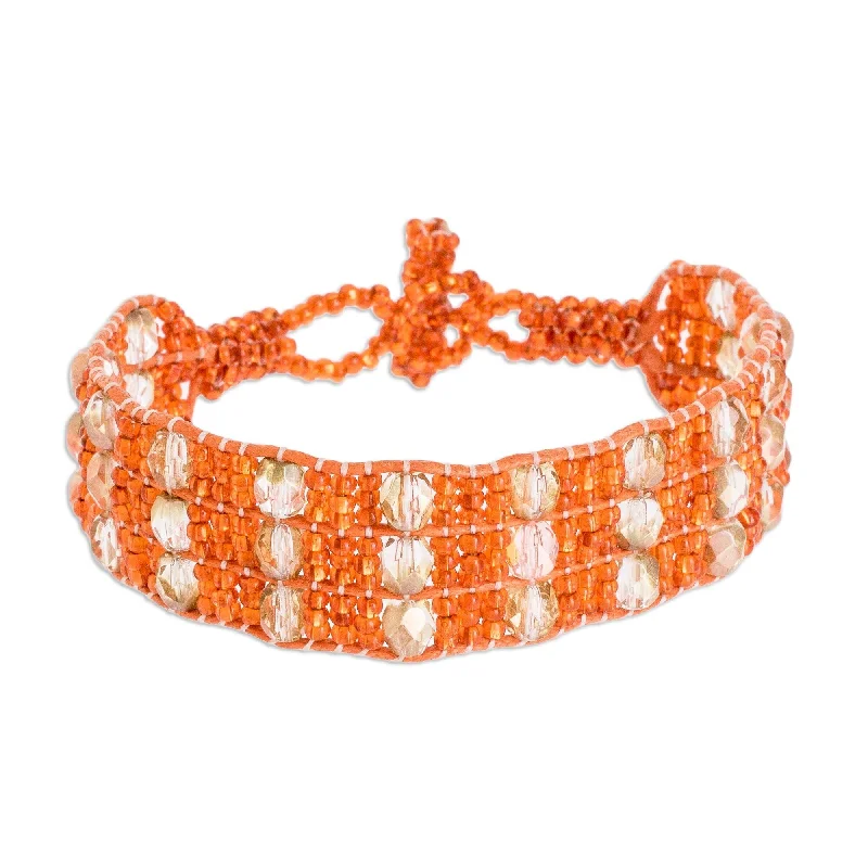 Ladies pearl bracelets-Novica Handmade Kinship In Orange Beaded Wristband Bracelet